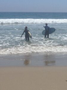 Seneca and Dad surfing in Malibu, CA